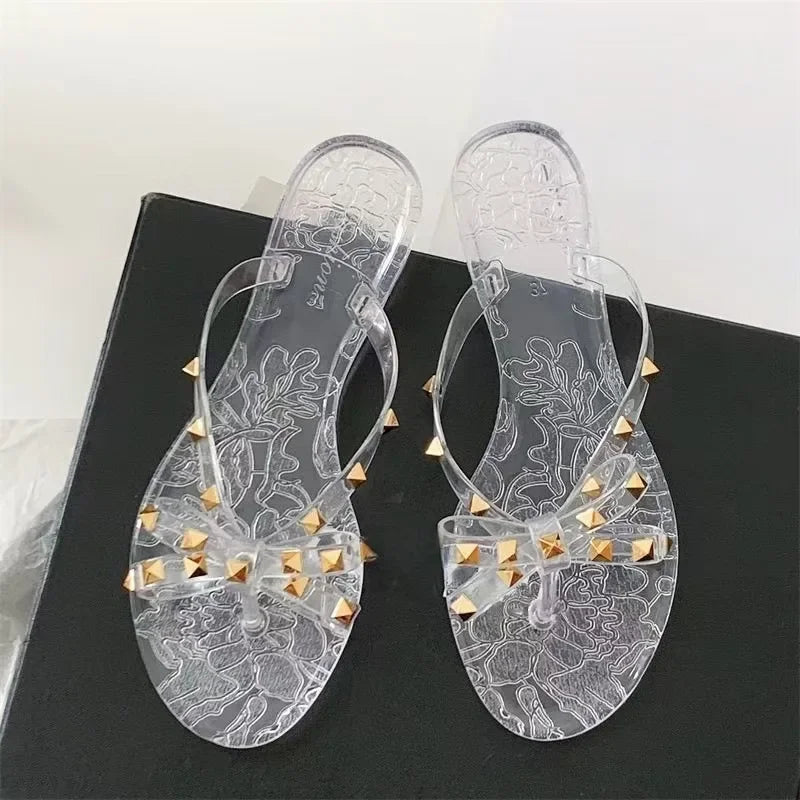 Transparent arch-adorned flip-flop